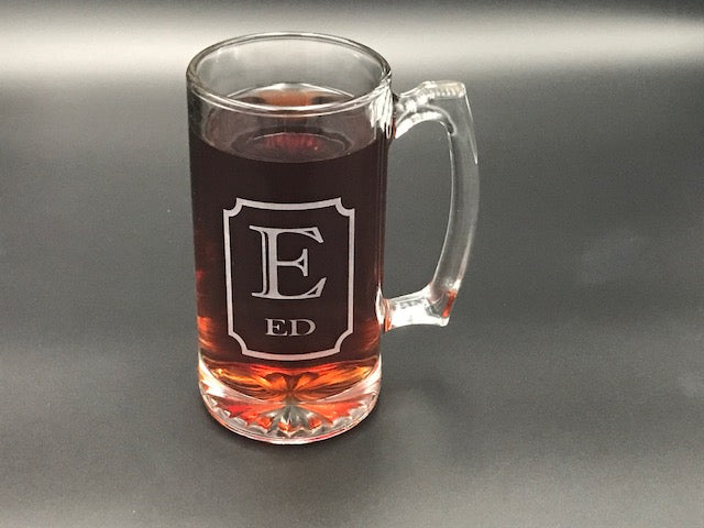 Customed etched beer glass that have the initial E and name Ed etched on with a boarder 
