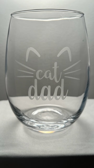 Steam-less wine glass with the saying cat dad with whiskers and ears etched on 