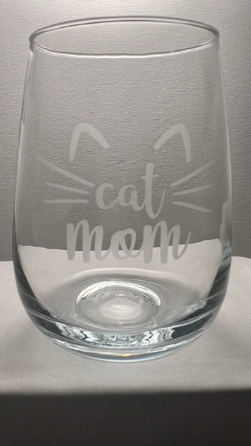 Steam-less wine glass with the saying cat mom with whiskers and ears etched on 