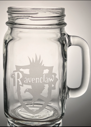 Mason Jar mug that have the house Ravenclaw etched on the mug