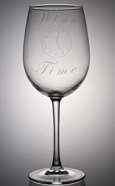 Wine glass that says "wine time" with a clock that is etched on the glass 